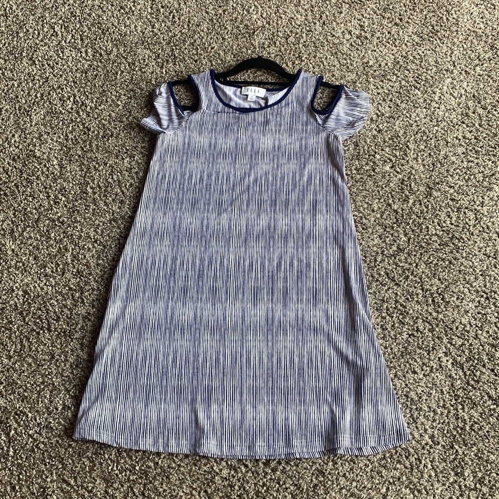 Blue and white dress with shoulder cut out.